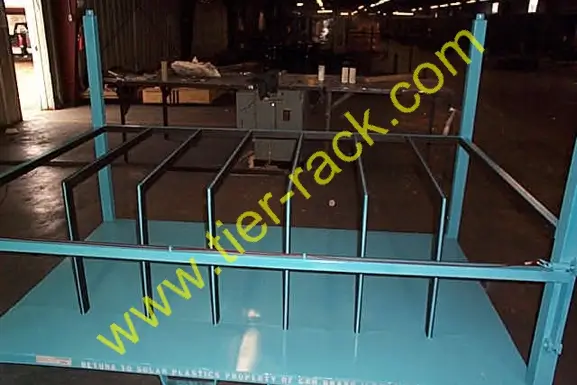 Warehouse rack bin sitting on the ground of a warehouse.